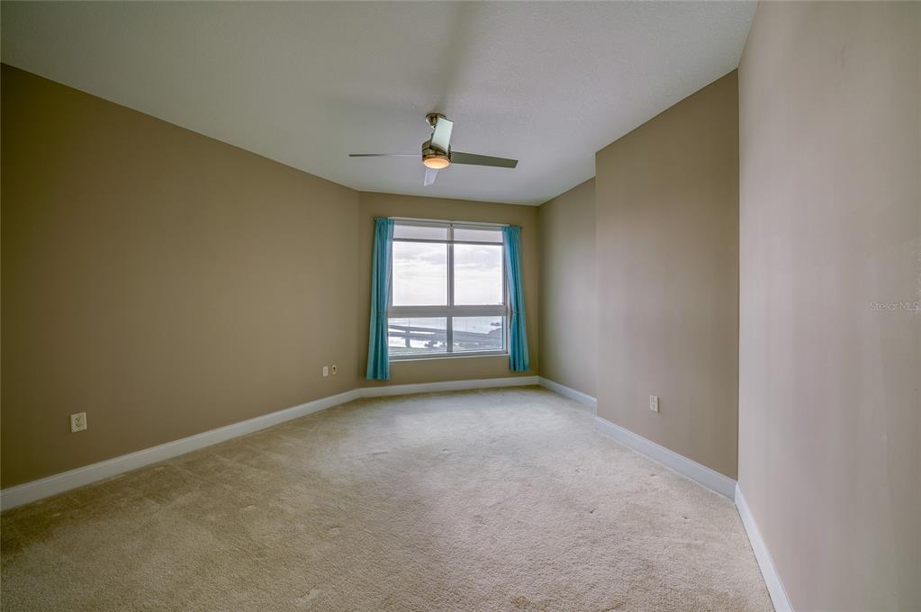 231 Riverside Drive, Unit 1703 Holly Hill, FL 32117 - Photo 17 of 41 an empty room with windows