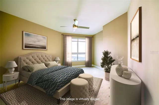 a bedroom with a bed couch and window