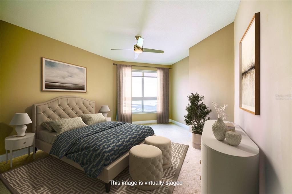 231 Riverside Drive, Unit 1703 Holly Hill, FL 32117 - Photo 18 of 41 a bedroom with a bed couch and window