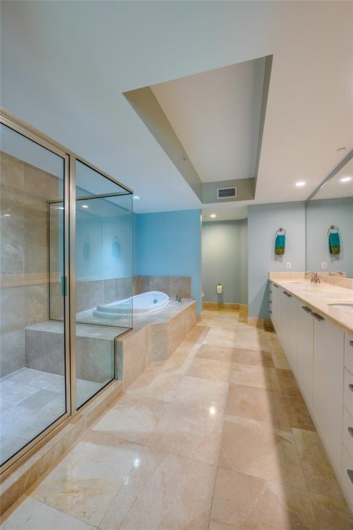 231 Riverside Drive, Unit 1703 Holly Hill, FL 32117 - Photo 24 of 41 a large white kitchen with a sink stainless steel appliances and cabinets