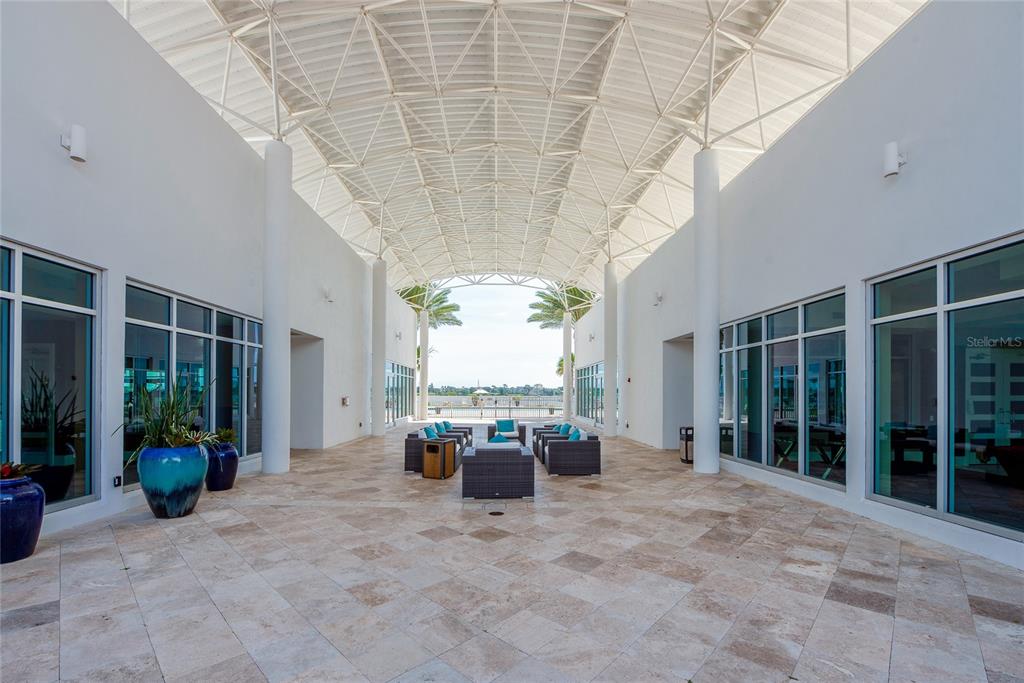 231 Riverside Drive, Unit 1703 Holly Hill, FL 32117 - Photo 35 of 41 a view of spacious bedroom with furniture and garden