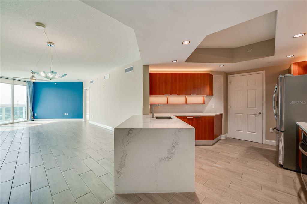 231 Riverside Drive, Unit 1703 Holly Hill, FL 32117 - Photo 6 of 41 a view of kitchen with granite countertop window and stainless steel appliances