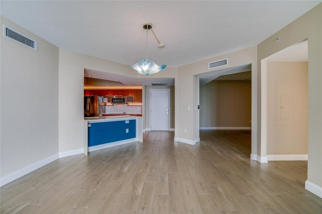 231 Riverside Drive, Unit 1703 Holly Hill, FL 32117 - Photo 9 of 41 a view of an empty room with window and wooden floor