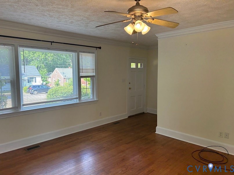311 5th Street Blackstone, VA 23824 - Photo 6 of 6 wooden floor in an empty room with a window