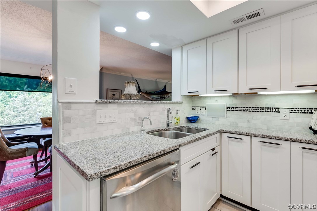 2956 Hathaway Road, Unit U306 Richmond, VA 23225 - Photo 13 of 36 a kitchen with stainless steel appliances granite countertop a sink and cabinets