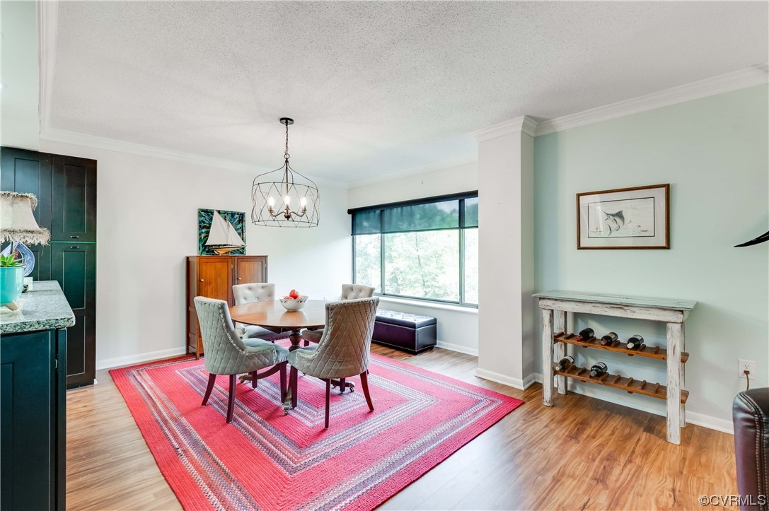 2956 Hathaway Road, Unit U306 Richmond, VA 23225 - Photo 14 of 36 a view of a dining room with furniture window and wooden floor