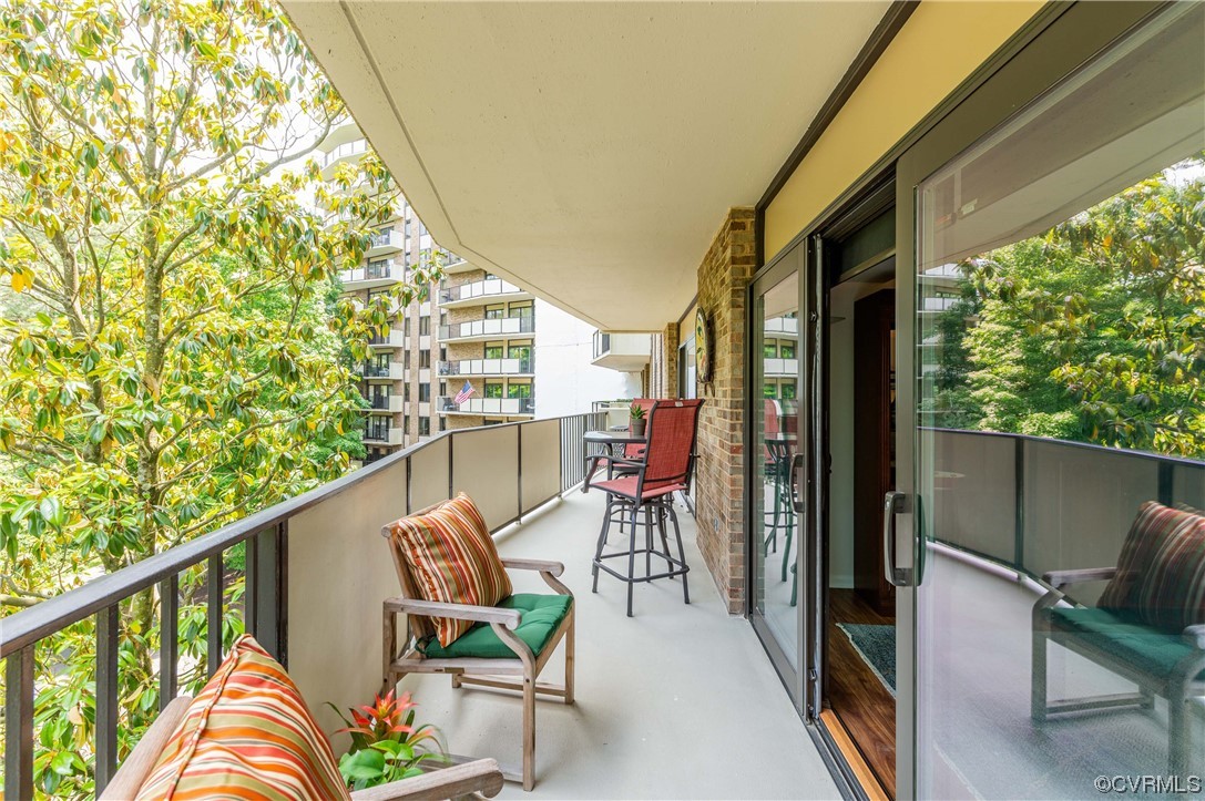 2956 Hathaway Road, Unit U306 Richmond, VA 23225 - Photo 20 of 36 a view of a chair and tables in the balcony