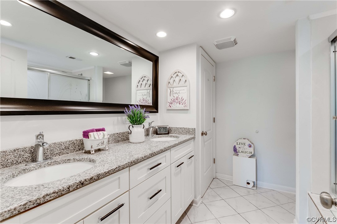 2956 Hathaway Road, Unit U306 Richmond, VA 23225 - Photo 26 of 36 a bathroom with a sink double vanity and a mirror