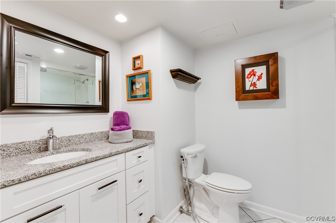 2956 Hathaway Road, Unit U306 Richmond, VA 23225 - Photo 30 of 36 a bathroom with a granite countertop sink mirror vanity and toilet