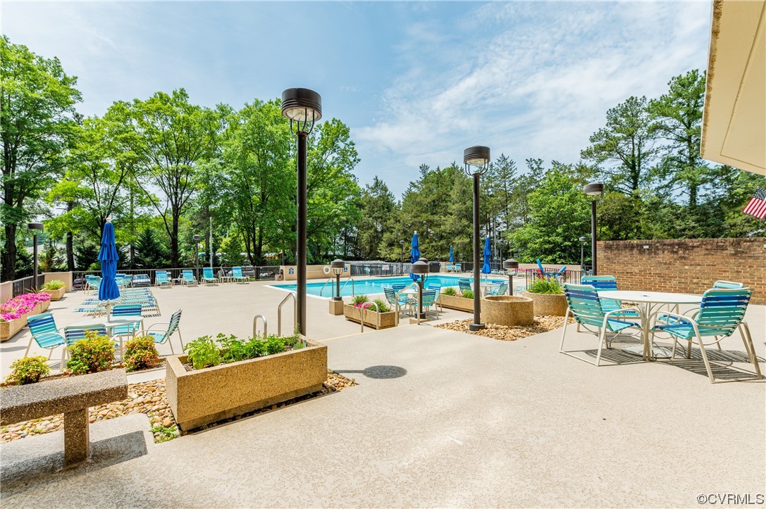 2956 Hathaway Road, Unit U306 Richmond, VA 23225 - Photo 33 of 36 a view of a swimming pool with a patio and fire pit