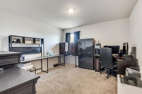 a view of a workspace with furniture