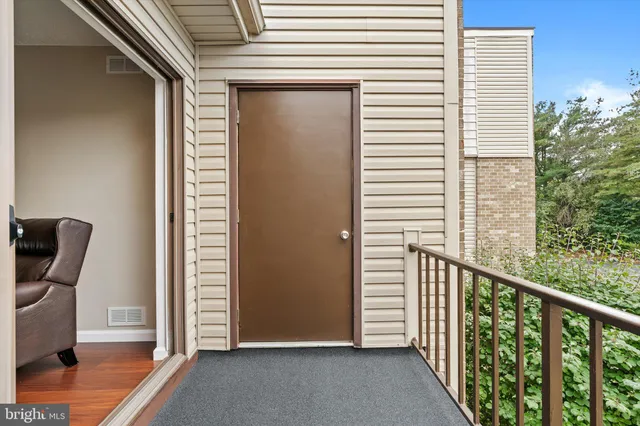 a view of a balcony with chair