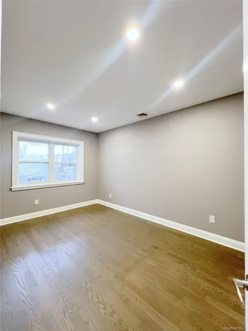 an empty room with a empty space and window