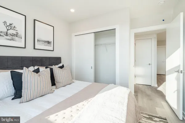 a bedroom with a bed and wall painting
