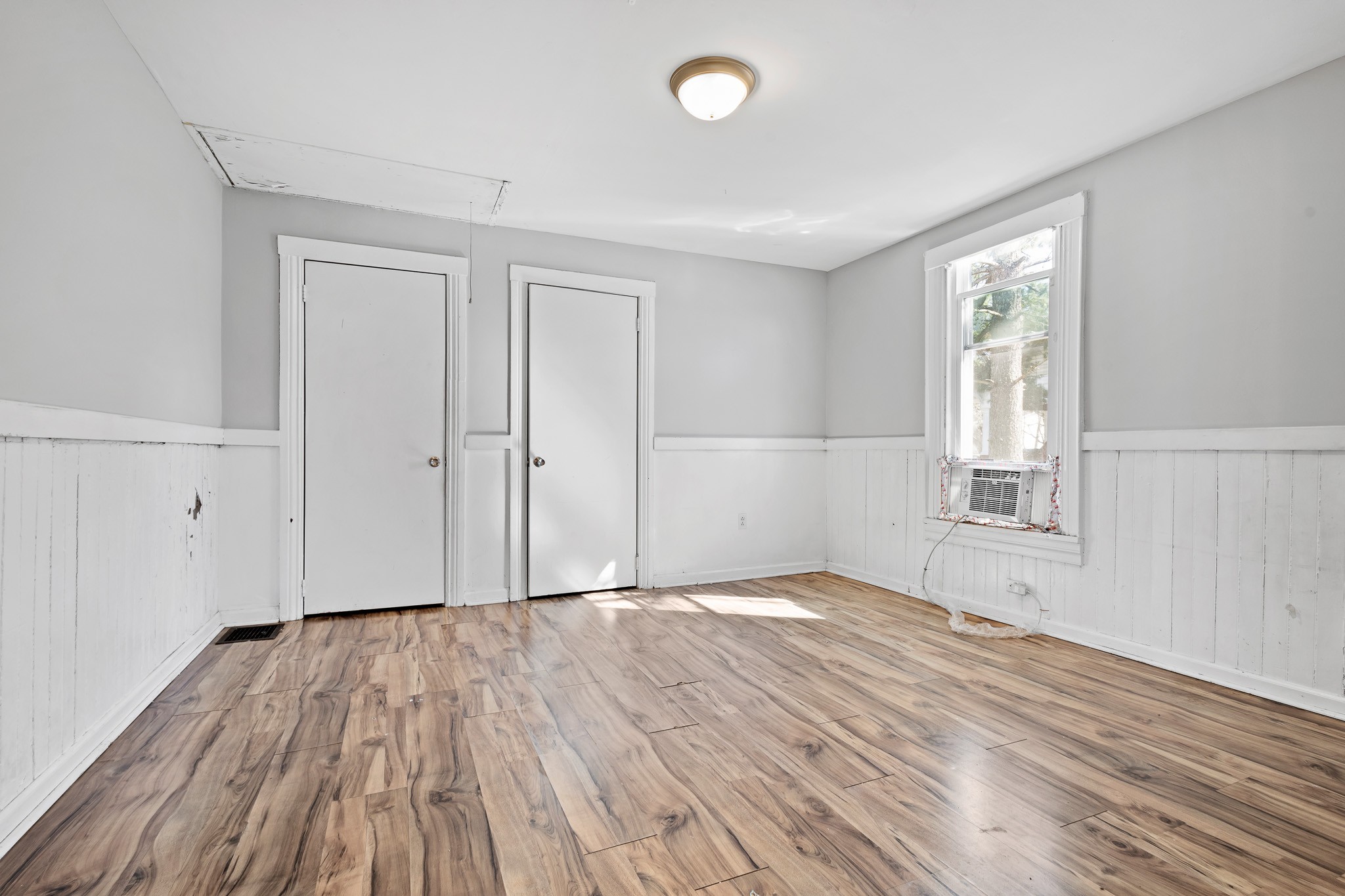1309 Batts Boulevard Springfield, TN 37172 - Photo 14 of 20 a view of an empty room with wooden floor and a window
