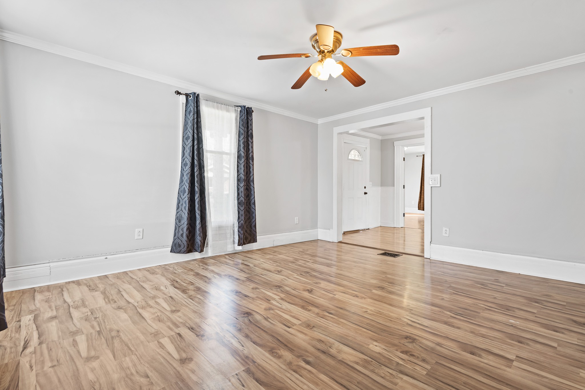 1309 Batts Boulevard Springfield, TN 37172 - Photo 5 of 20 wooden floor in an empty room with a window