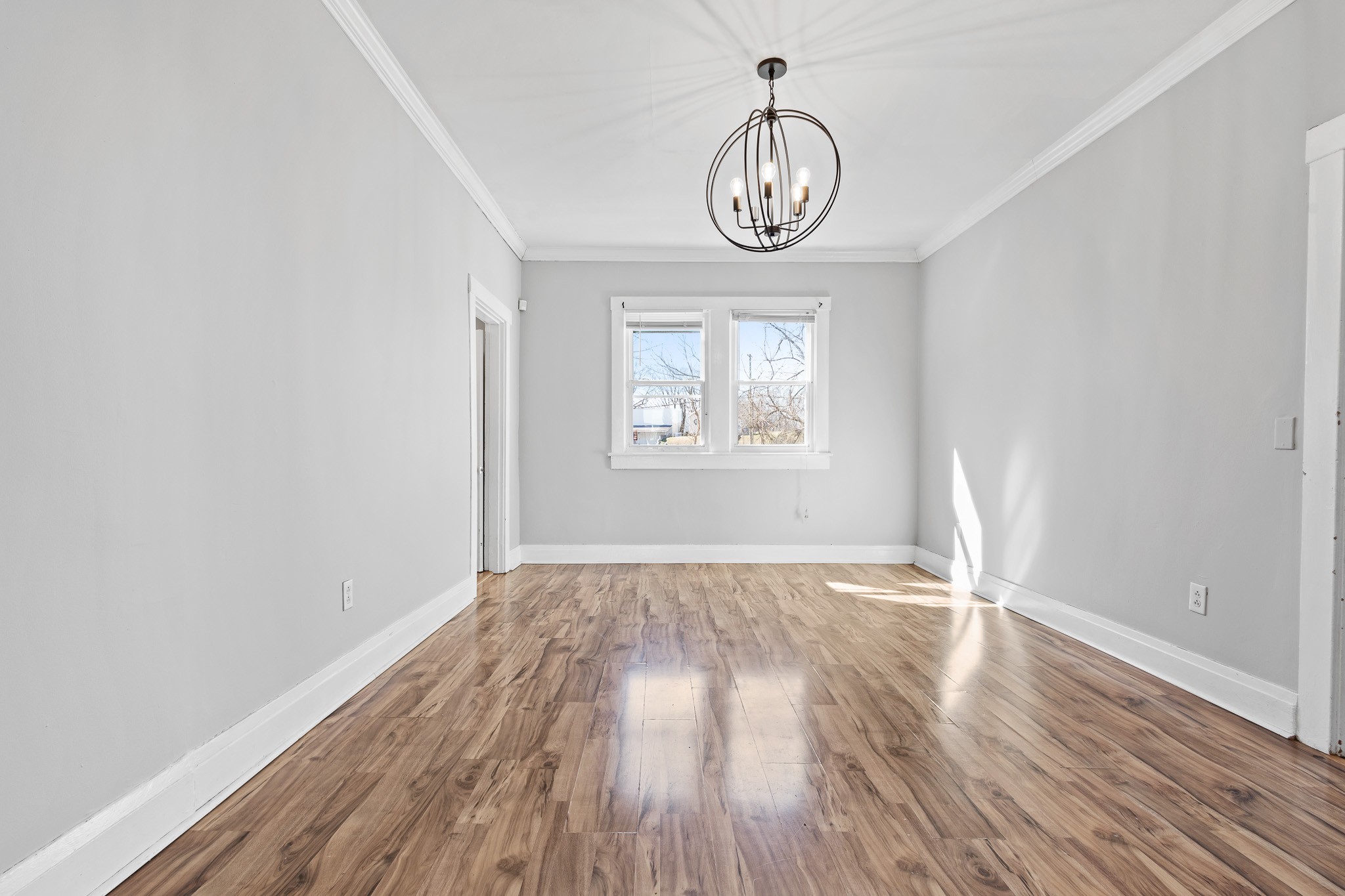 1309 Batts Boulevard Springfield, TN 37172 - Photo 10 of 20 an empty room with wooden floor and windows