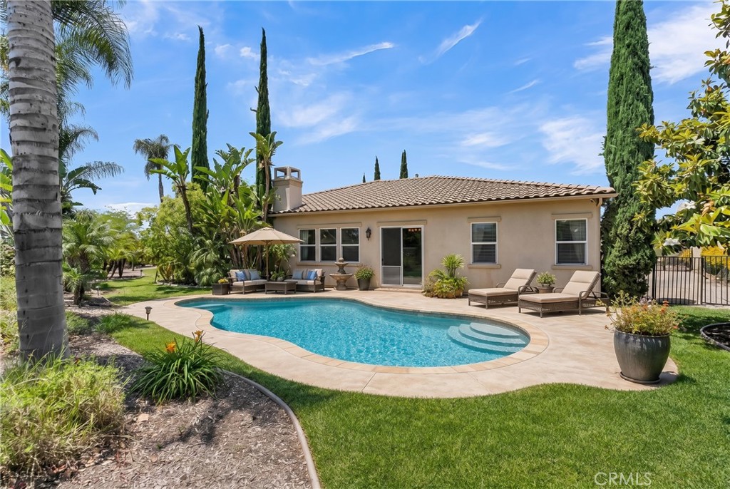 7780 Solitude Court Riverside, CA 92506 - Photo 47 of 71 a view of a house with swimming pool and sitting area