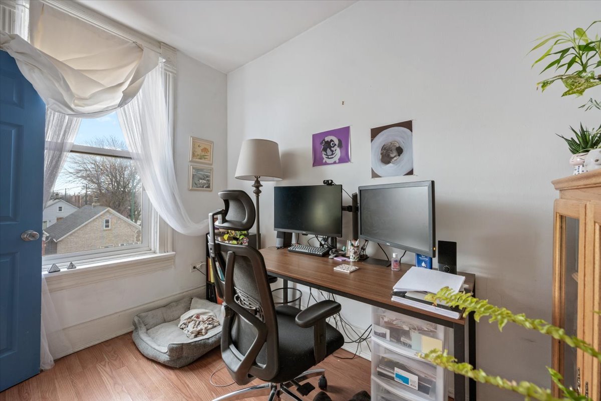 934 West 35th Place Chicago, IL 60609 - Photo 12 of 24 a work room with furniture and wooden floor