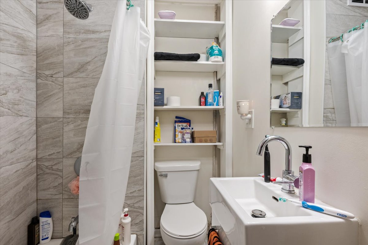 934 West 35th Place Chicago, IL 60609 - Photo 18 of 24 a bathroom with a sink and a toilet