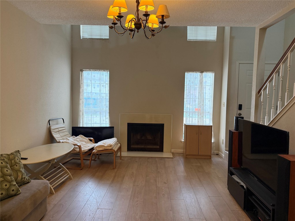 7575 Cambridge Street, Unit 2704 Houston, TX 77054 - Photo 1 of 28 a living room with furniture and a flat screen tv