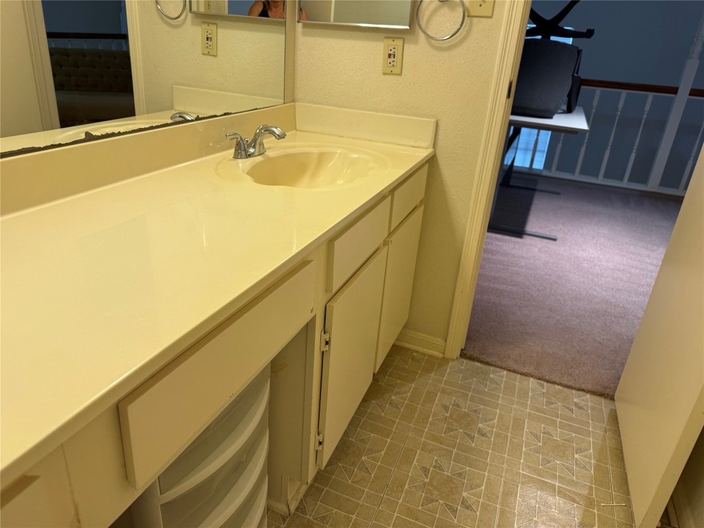 7575 Cambridge Street, Unit 2704 Houston, TX 77054 - Photo 21 of 28 a bathroom with a sink and mirror