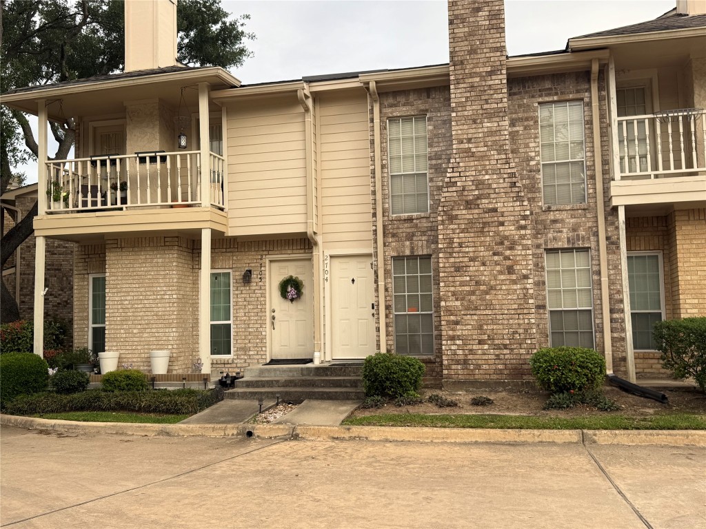 7575 Cambridge Street, Unit 2704 Houston, TX 77054 - Photo 24 of 28 a front view of a house with a yard
