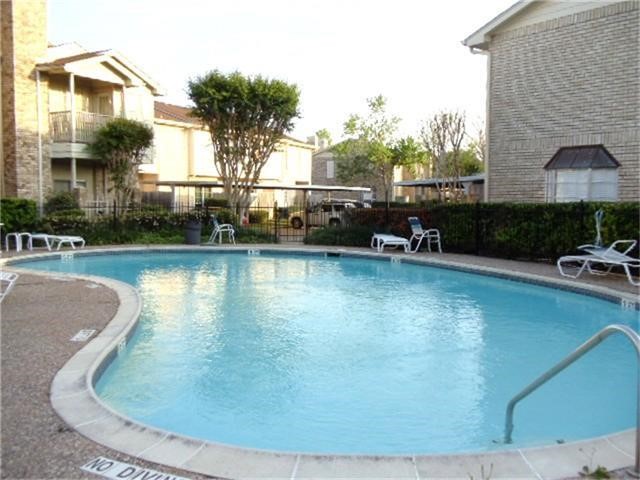 7575 Cambridge Street, Unit 2704 Houston, TX 77054 - Photo 28 of 28 a view of a swimming pool with a patio