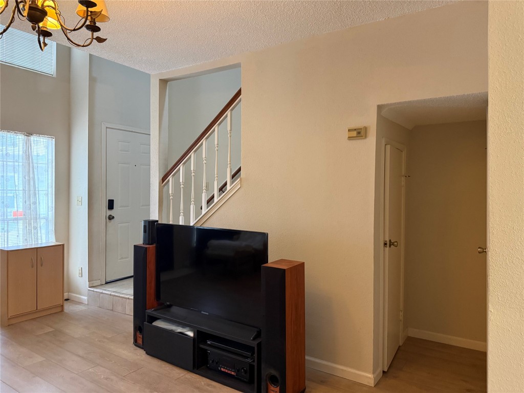 7575 Cambridge Street, Unit 2704 Houston, TX 77054 - Photo 3 of 28 a view of entryway with wooden floor and stairs