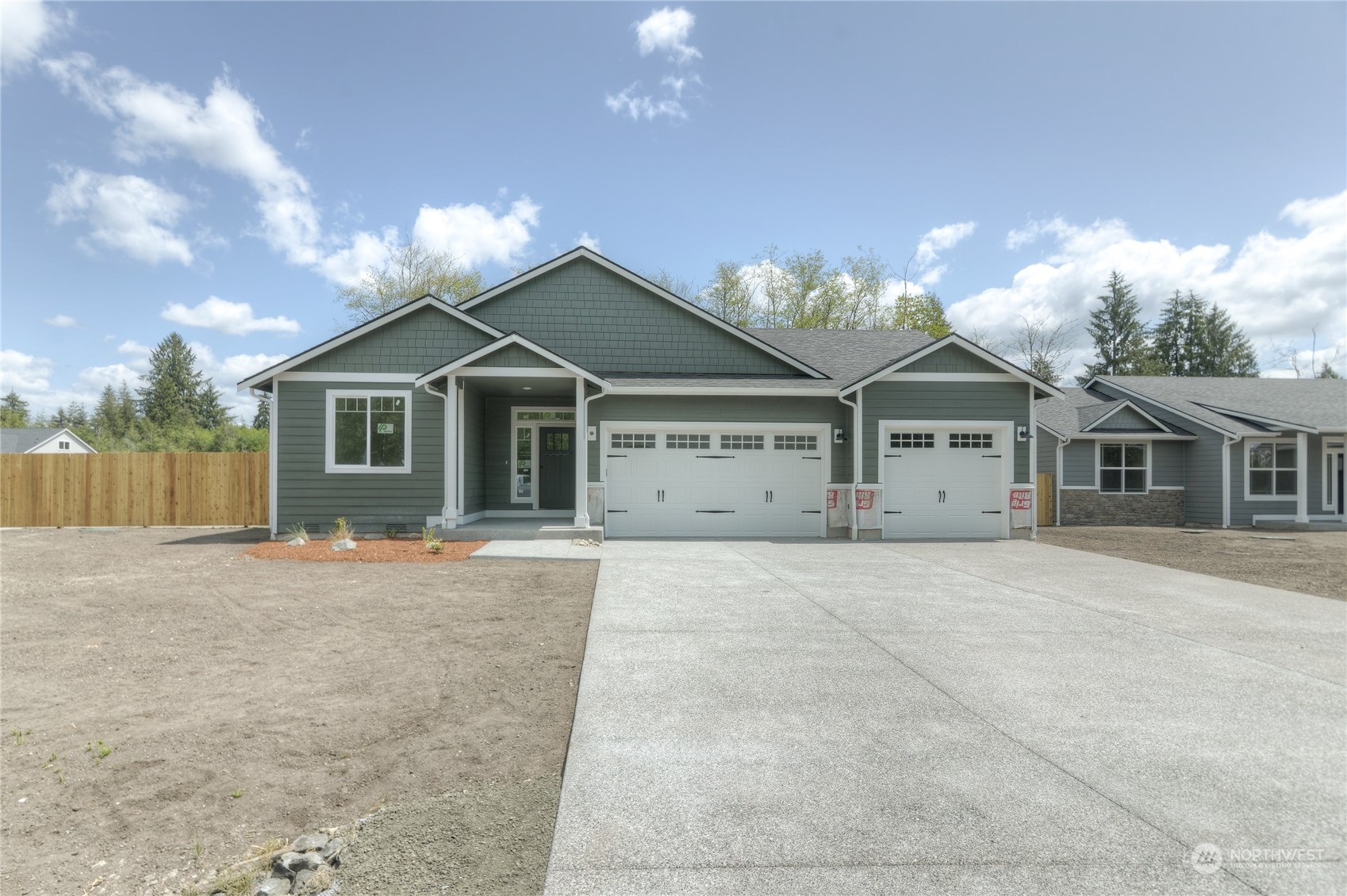 32 Roup Road Montesano, WA 98563 - Photo 1 of 20 a front view of a house with a yard and garage