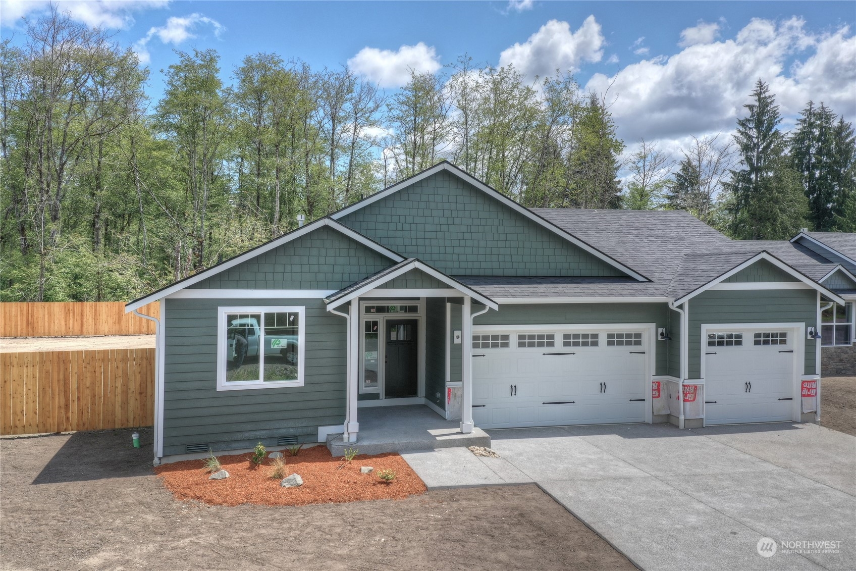 32 Roup Road Montesano, WA 98563 - Photo 2 of 20 a view of a house with a yard and garage