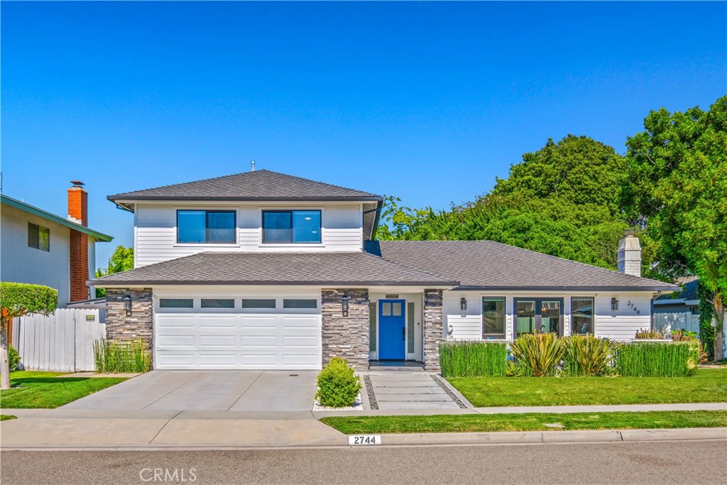 2744 Gannet Drive Costa Mesa, CA 92626 - Photo 1 of 39 a front view of a house with a yard and potted plants