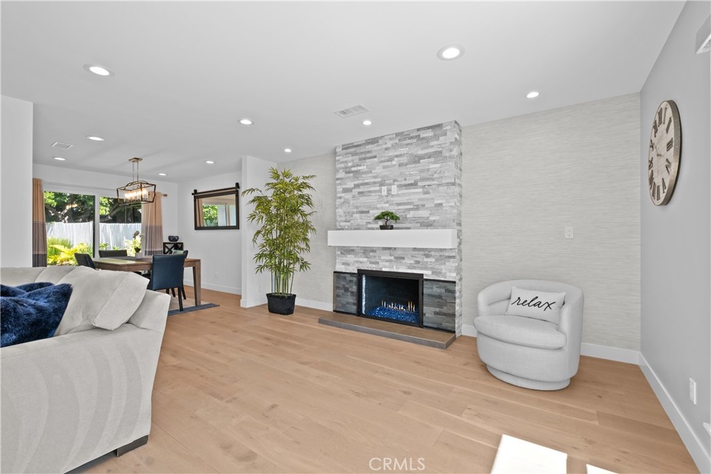 2744 Gannet Drive Costa Mesa, CA 92626 - Photo 13 of 39 a living room with furniture and a fireplace