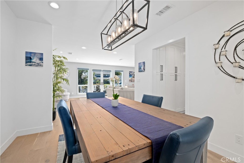 2744 Gannet Drive Costa Mesa, CA 92626 - Photo 20 of 39 a view of a dining room with furniture window and wooden floor