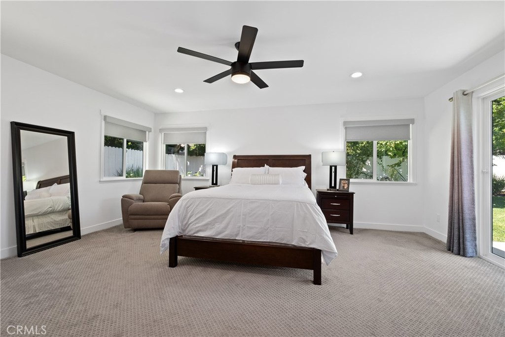 2744 Gannet Drive Costa Mesa, CA 92626 - Photo 22 of 39 a bedroom with a bed a couch and a window
