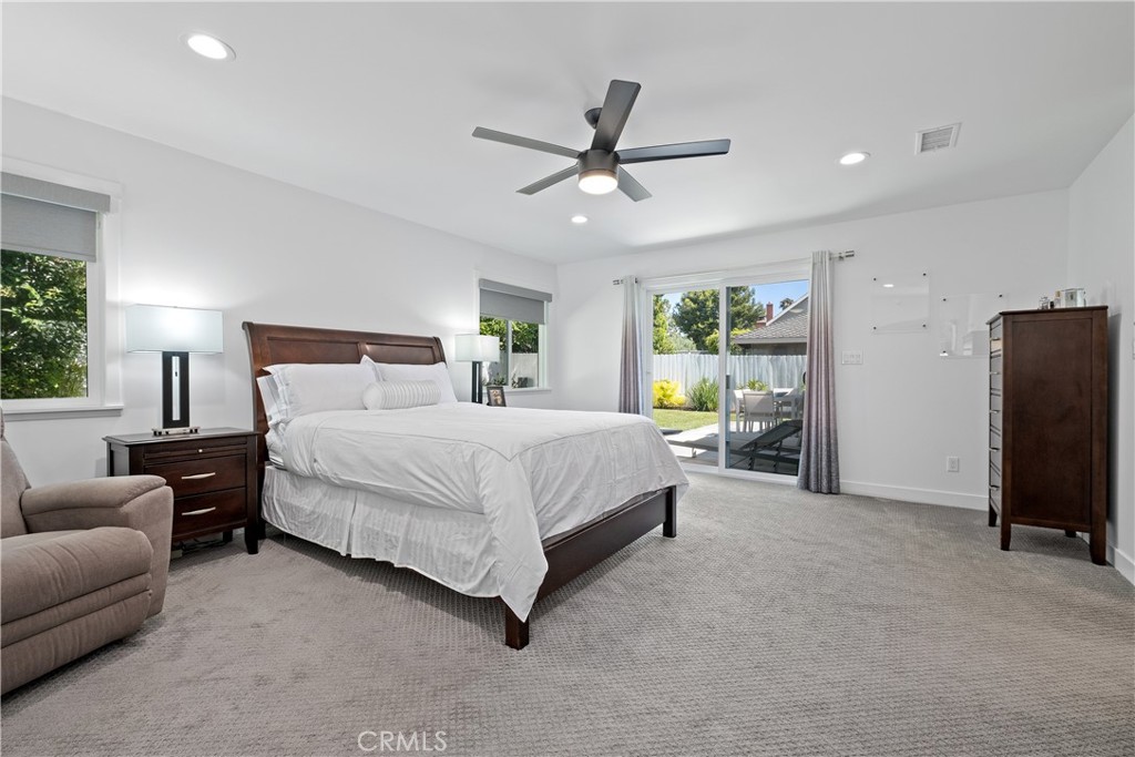 2744 Gannet Drive Costa Mesa, CA 92626 - Photo 23 of 39 a bedroom with a bed and ceiling fan