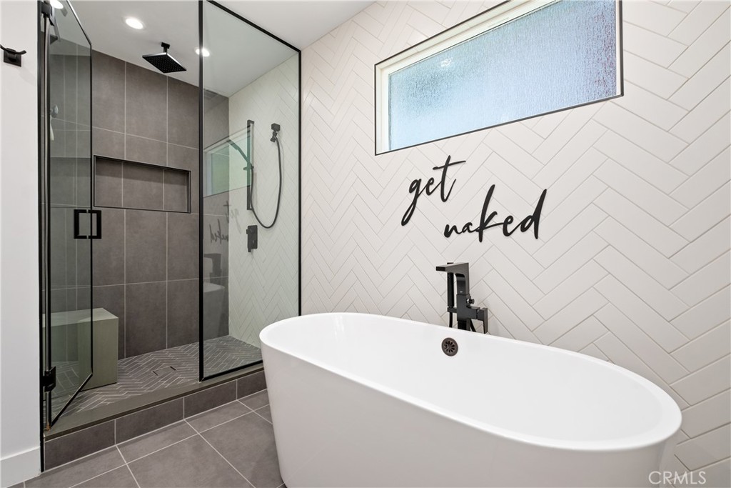 2744 Gannet Drive Costa Mesa, CA 92626 - Photo 25 of 39 a bathroom with a sink a mirror and shower