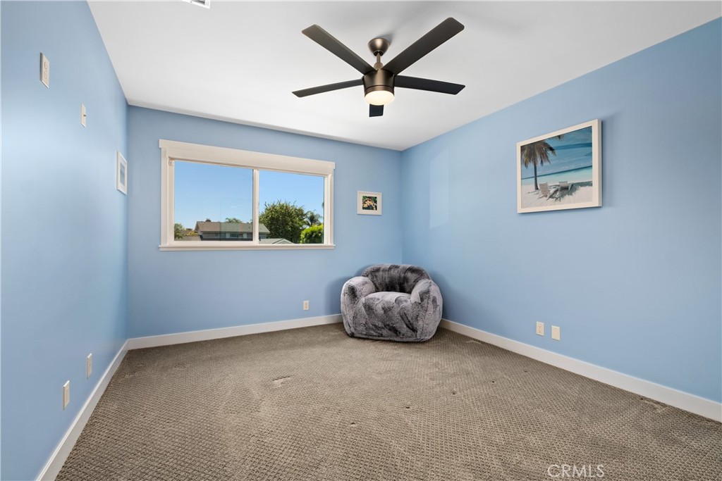 2744 Gannet Drive Costa Mesa, CA 92626 - Photo 26 of 39 an empty room with windows and fan