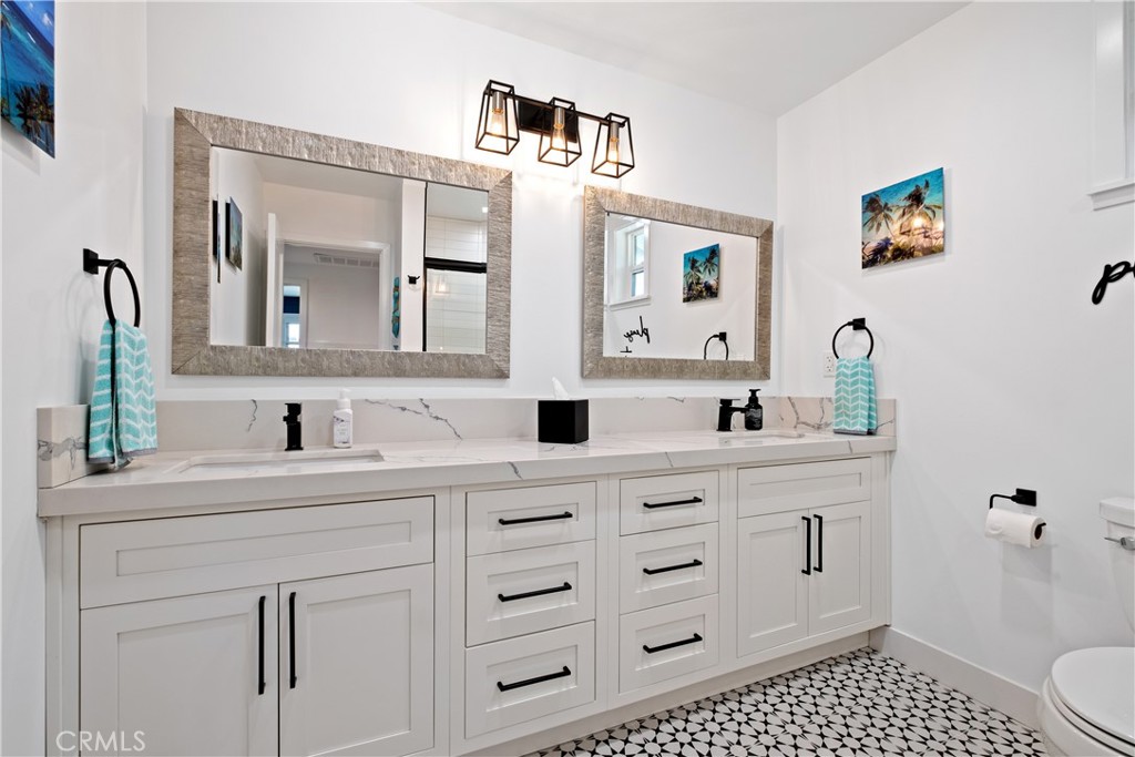 2744 Gannet Drive Costa Mesa, CA 92626 - Photo 31 of 39 a bathroom with a sink vanity and mirror