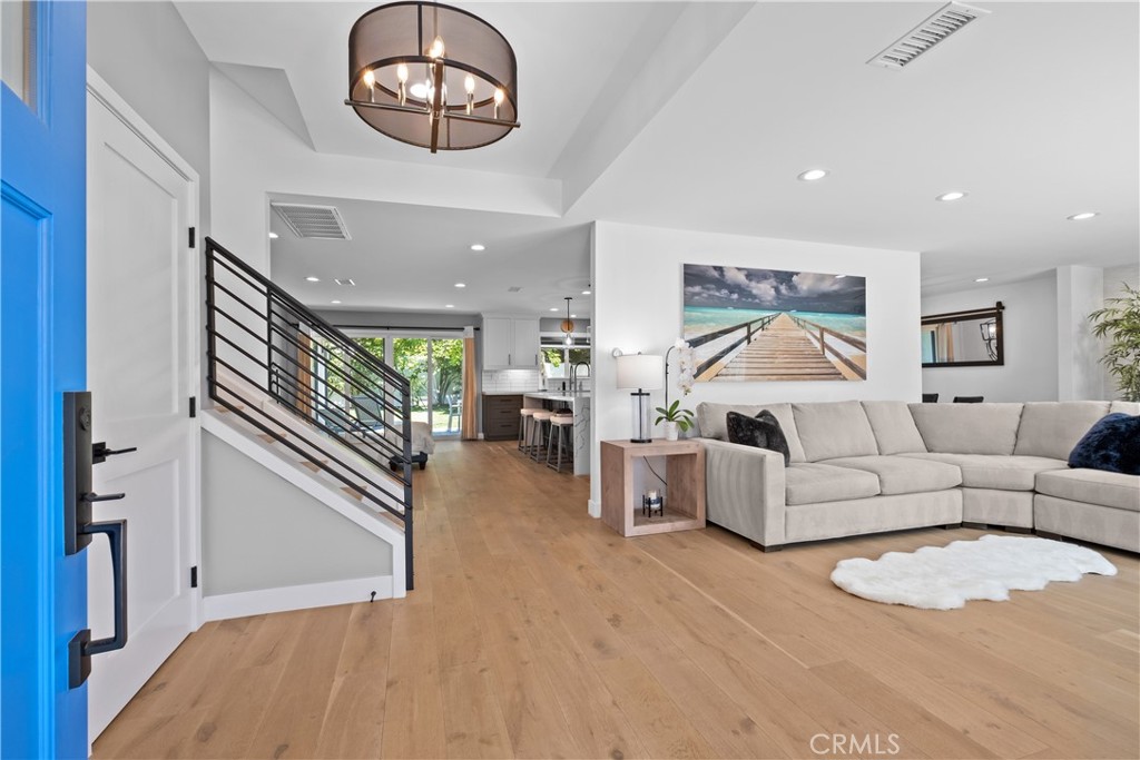 2744 Gannet Drive Costa Mesa, CA 92626 - Photo 39 of 39 a living room with furniture and a wooden floor