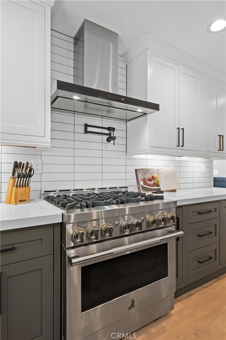 2744 Gannet Drive Costa Mesa, CA 92626 - Photo 9 of 39 a stove top oven sitting inside of a kitchen
