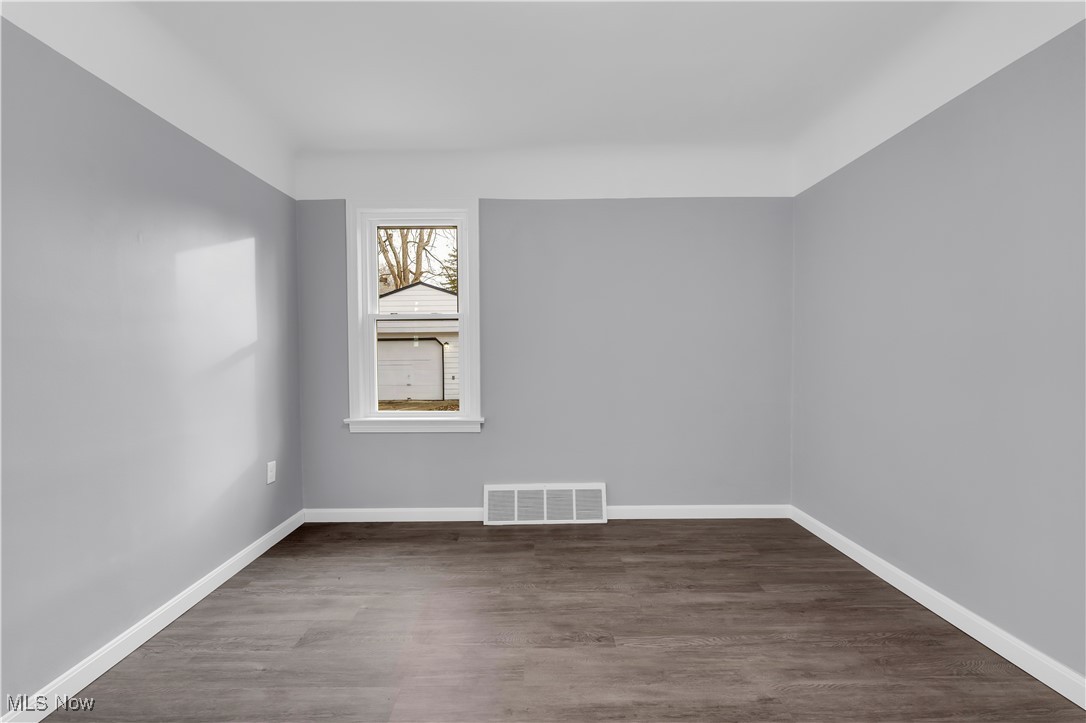 953 Whitby Road Cleveland Heights, OH 44112 - Photo 15 of 27 Unfurnished room with wood finished floors