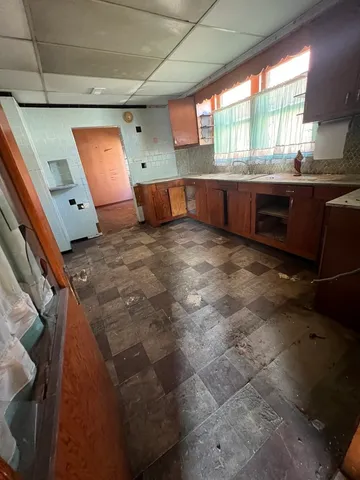 a kitchen with stainless steel appliances granite countertop a sink and cabinets