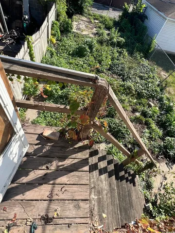 a view of balcony with wooden floor