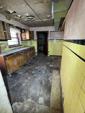 a bathroom with a sink and mirror