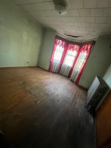 a view of an empty room and window