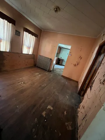 a view of an empty room and window