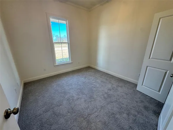 a kitchen with a sink and a refrigerator