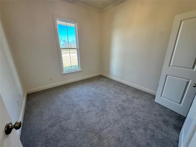 a kitchen with a sink and a refrigerator