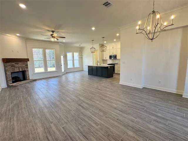 a view of kitchen and kitchen with wooden floor